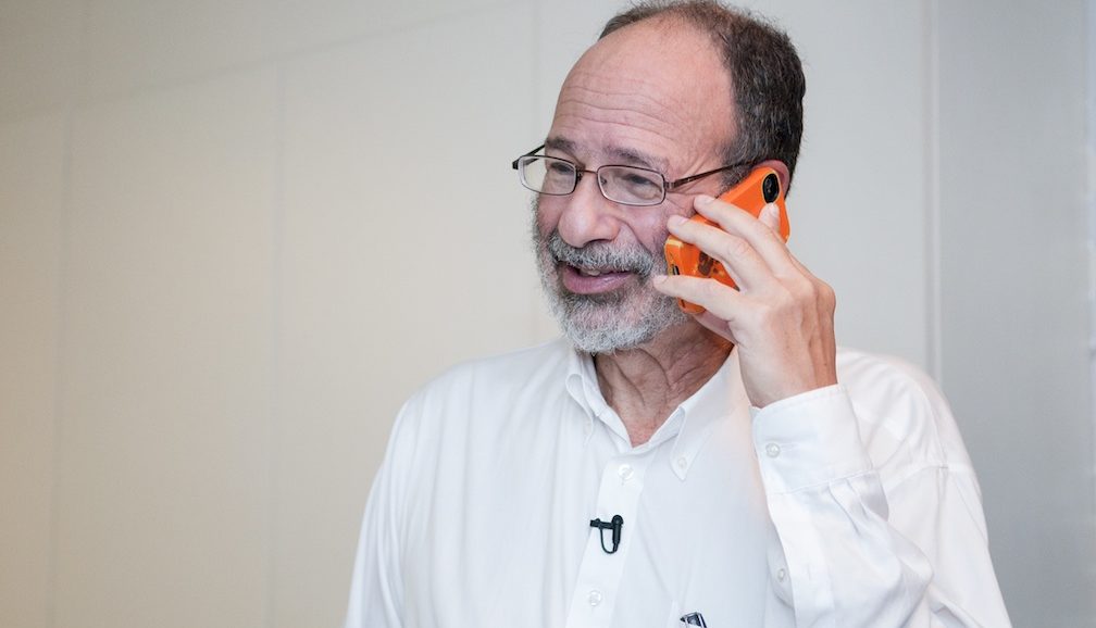 researcher Alvin Roth on phone