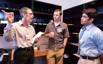 Professor Russ Altman speaks with MD/PhD students Andy Loening, center, and Raag Airan, right, who are members of the first group of students to enroll in the new bioengineering department.