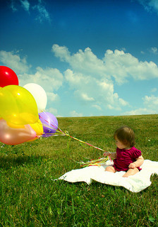 baby with balloon