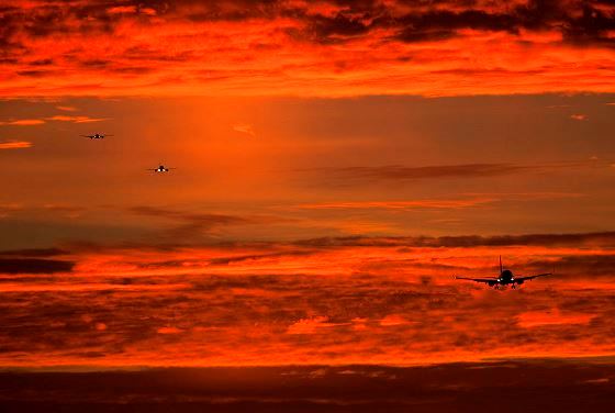jets landing in sunset