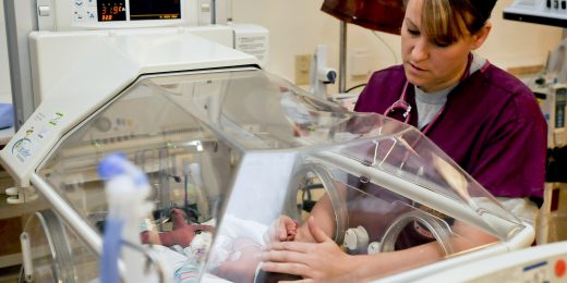 How does burnout affect NICU caregivers and their patients?
