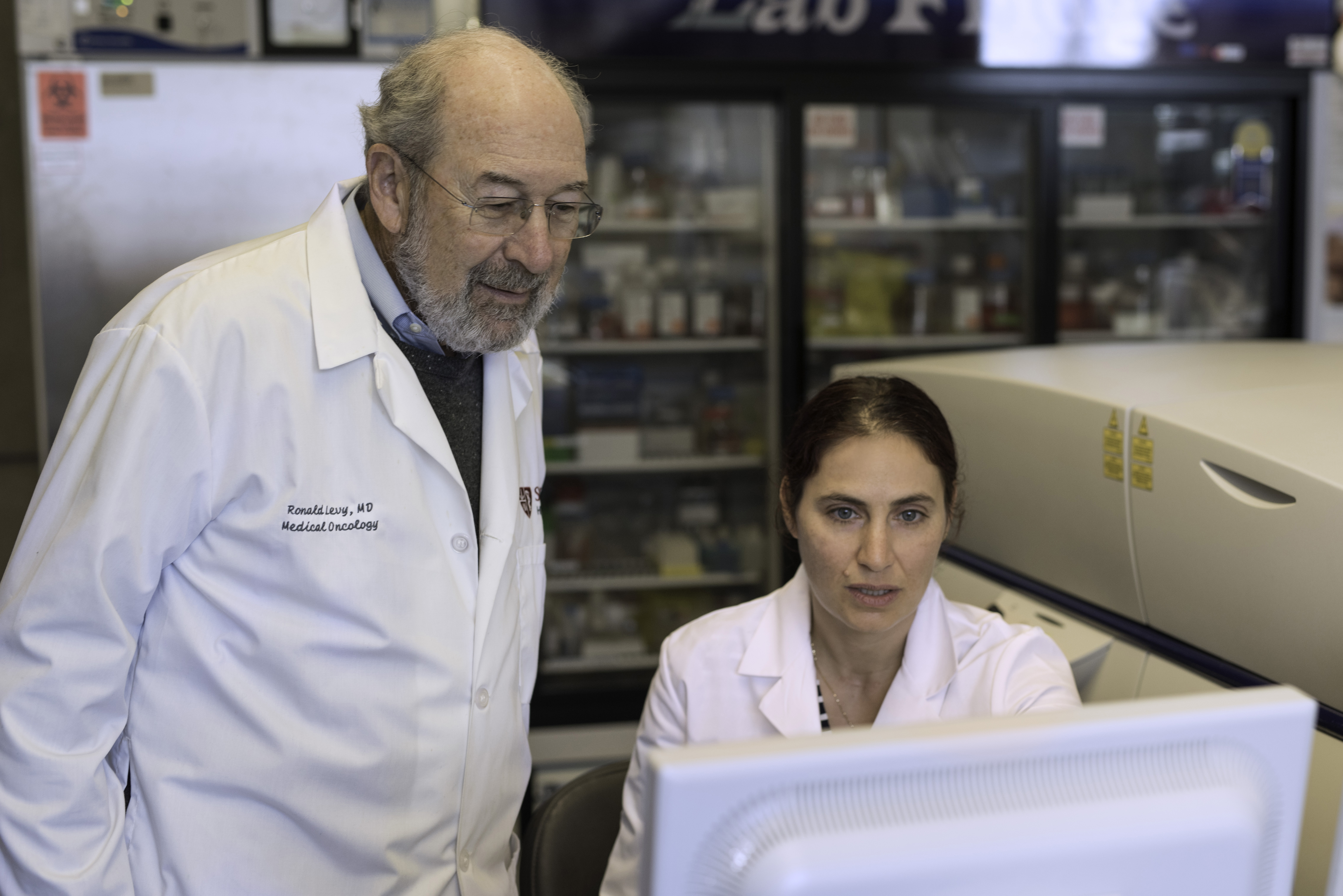Stanford cancer researchers Ronald Levy and Idit Sagiv-Barfi in the lab