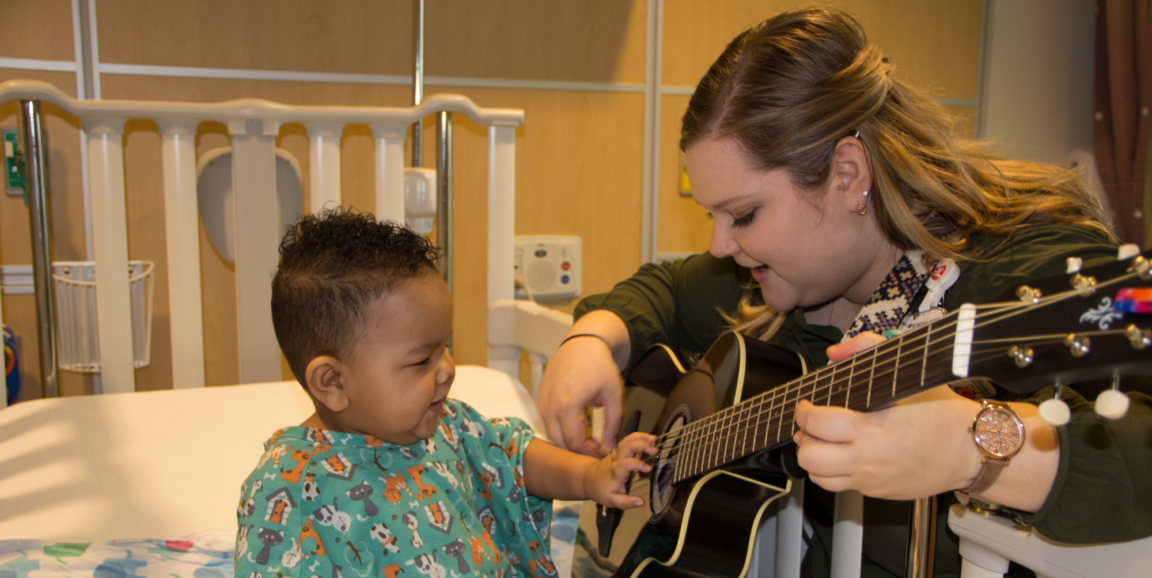 Music therapist Cassi Crouse works with a young patient