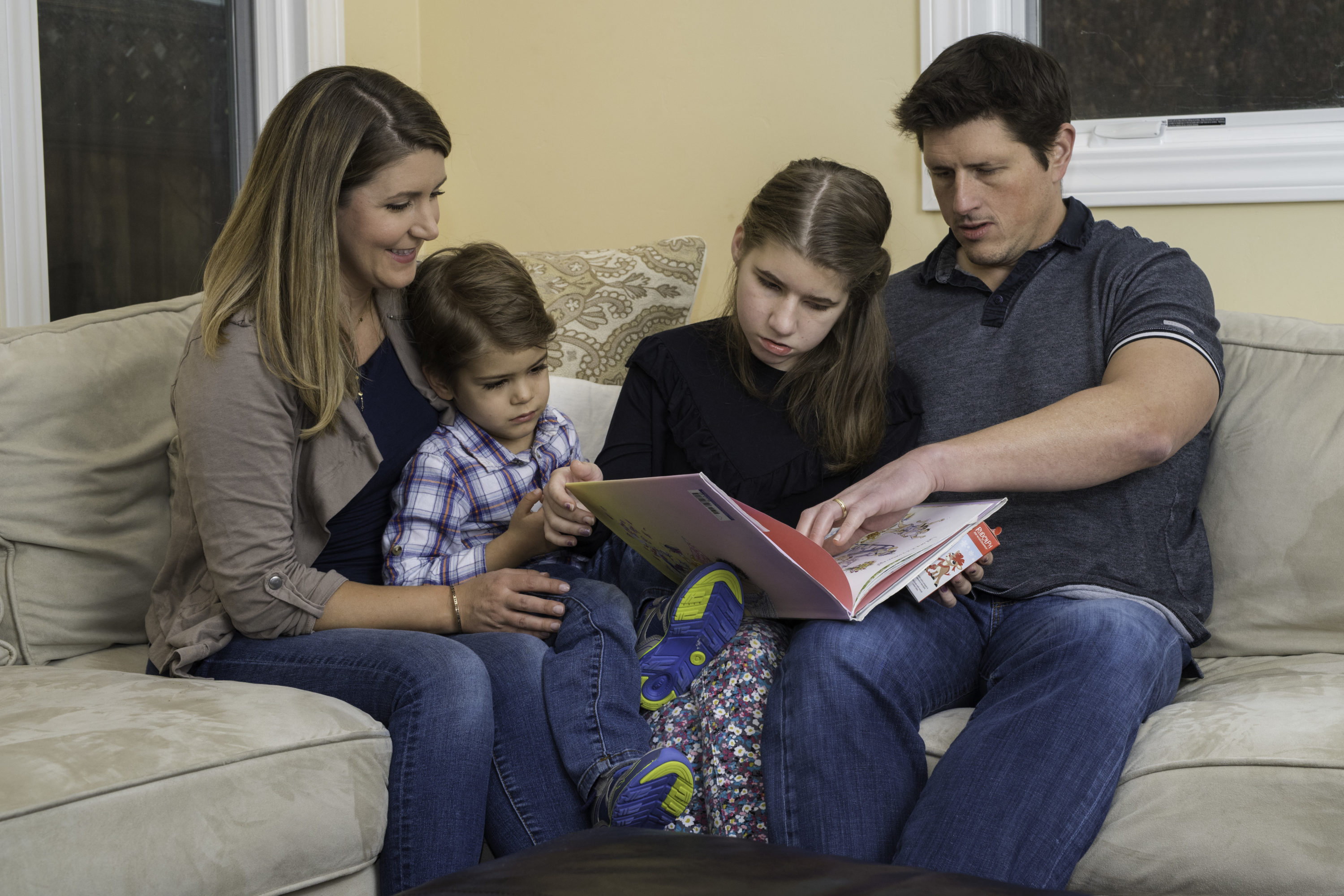 Nye family reading a book