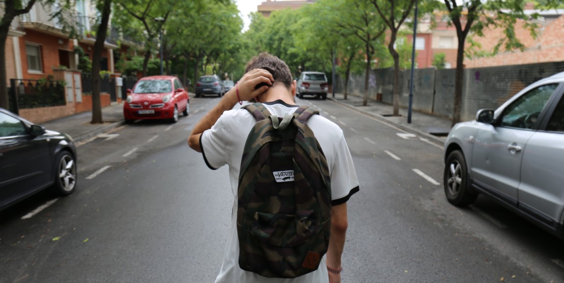 Walking boy with backpack