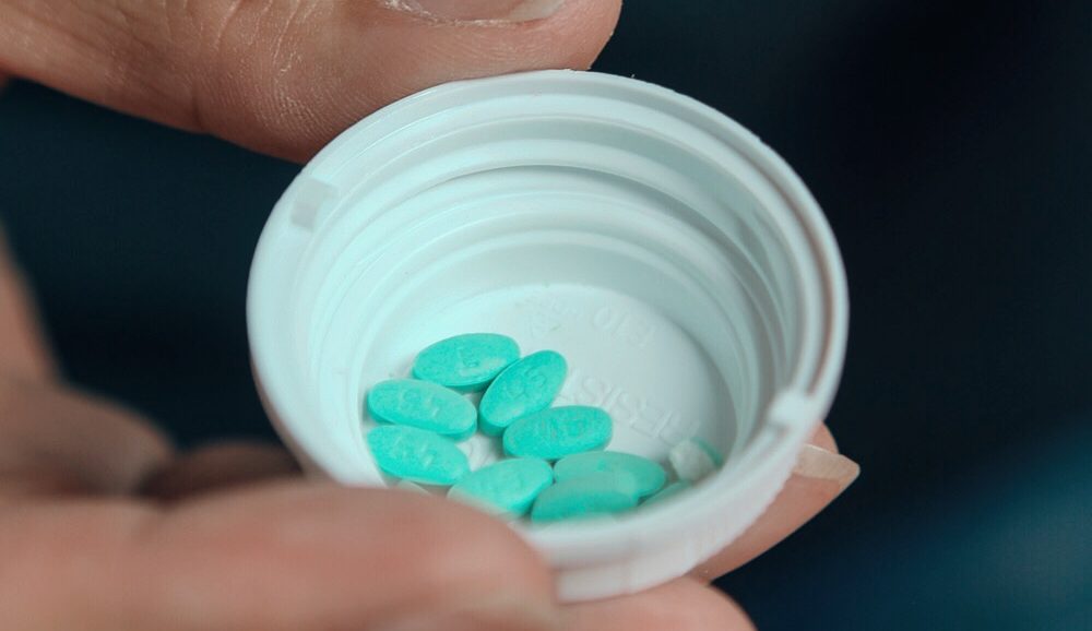 Pills in pill bottle cap
