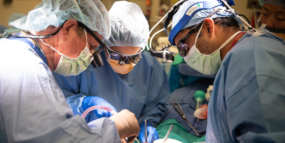 Three surgeons operate