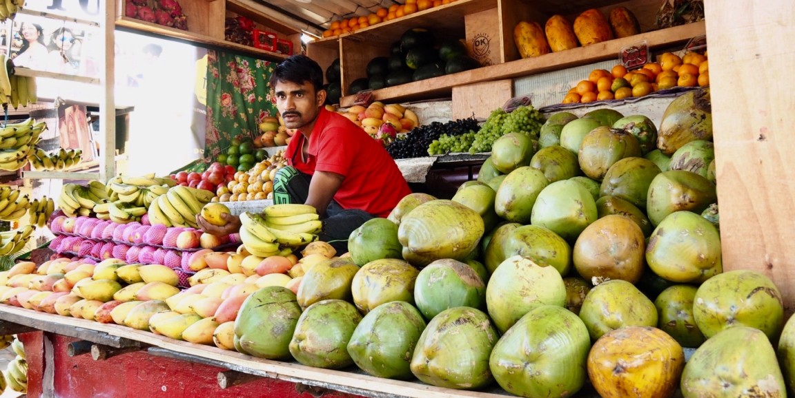 man selling fruit in India