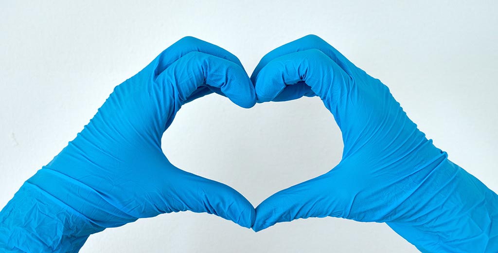heart shaped gloved fingers COVID-19