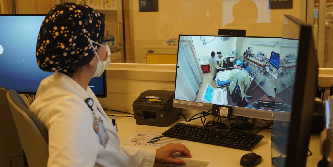 physician looking at procedure on the screen