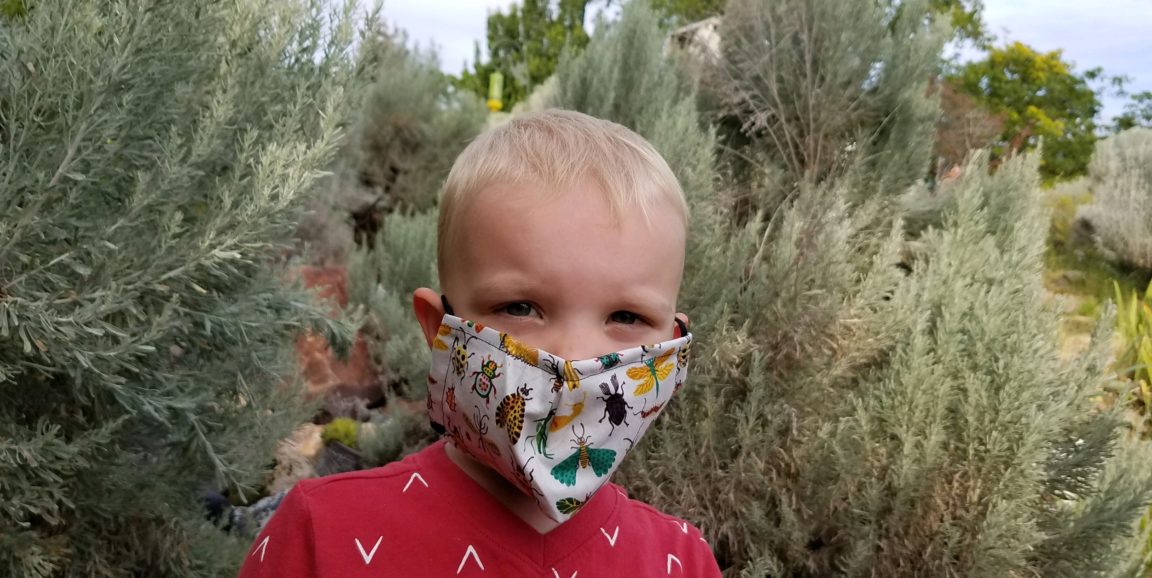 child wearing mask during COVID-19 pandemic