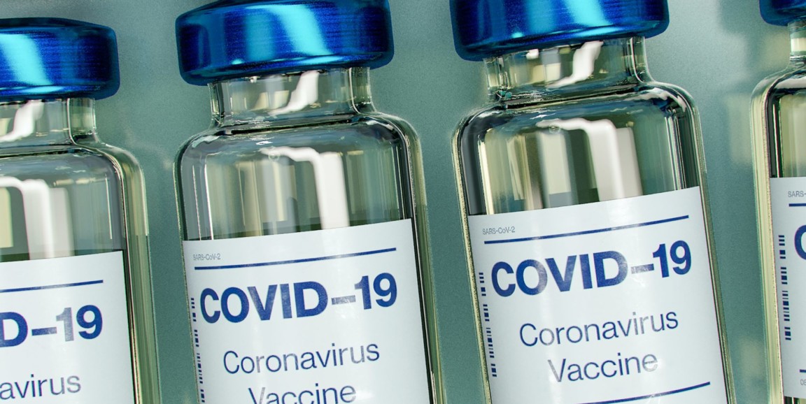 Jars labeled "COVID-19 coronavirus vaccine" aline in rows.