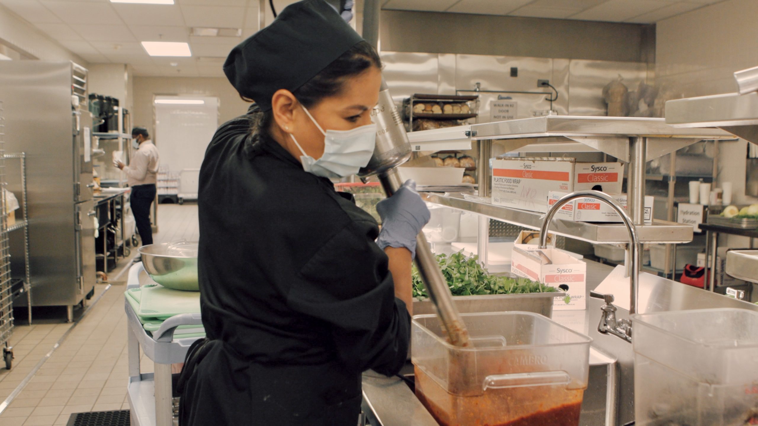 A photograph of Stanford Health Care's Hilda Fabian preparing salsa for chilaquiles.
